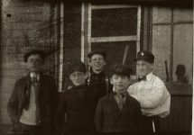 Four boys and “policeman” brandishing his billy-club. EW Carter photo ca. 1900 Split Glass negative: 7″x5″