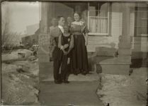 Double exposure of man and “five” women standing on front steps. EW Carter photo ca. 1900 Glass negative: 7″x5″