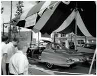 1956 OLDSMOBILE Experimental “Golden Rocket” 5″x4″ black & white negative E-2 X23388-51 A lightweight, fiberglass-bodied sports coupe for GM Motorama Oldsmobile Greets NOBLES Of The MYSTIC SHRINE Near Hotel Staler Detroit, Michigan ca. 1956 275-hp “Rocket” V-8 engine Compression Ratio 9.50 to 1 Width 75.4″ Height 49.5″ Wheelbase 105″ Length 201.1″ Front Tread 59″ Rear Tread 56″