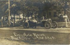 1910 Elgin Auto Races Black Crow Stinson in the ditch RPPC front