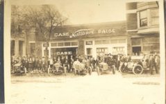 1913-1914 ca. CASE National PAIGE car dealership Left to right are two 1913 chain drive Indy cars. These cars had Wisconsin 450 racing engines. Next is the Case Tornado six cylinder proprietary built engine. Last racer is one of the 1911 Case racers RPPC front