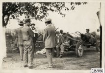 1910 NATIONAL Vanderbilt Cup Races Men at National Racing Camp on roadside Johnny Aitken on left in overalls photo Burton Historical Collection Detroit Public Library
