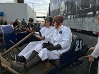 2020 1 15 PORSCHE Works Driver Patrick Long getting a driving lesson from Brian Blain in a 1911 NATIONAL Indy racer Car 20 Bondurant Raceway Phoenix