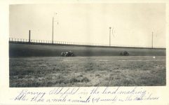 1919 ca. Barney Oldfield in the lead making better than a mile a minute 41 seconds on the Motordrome RPPC front